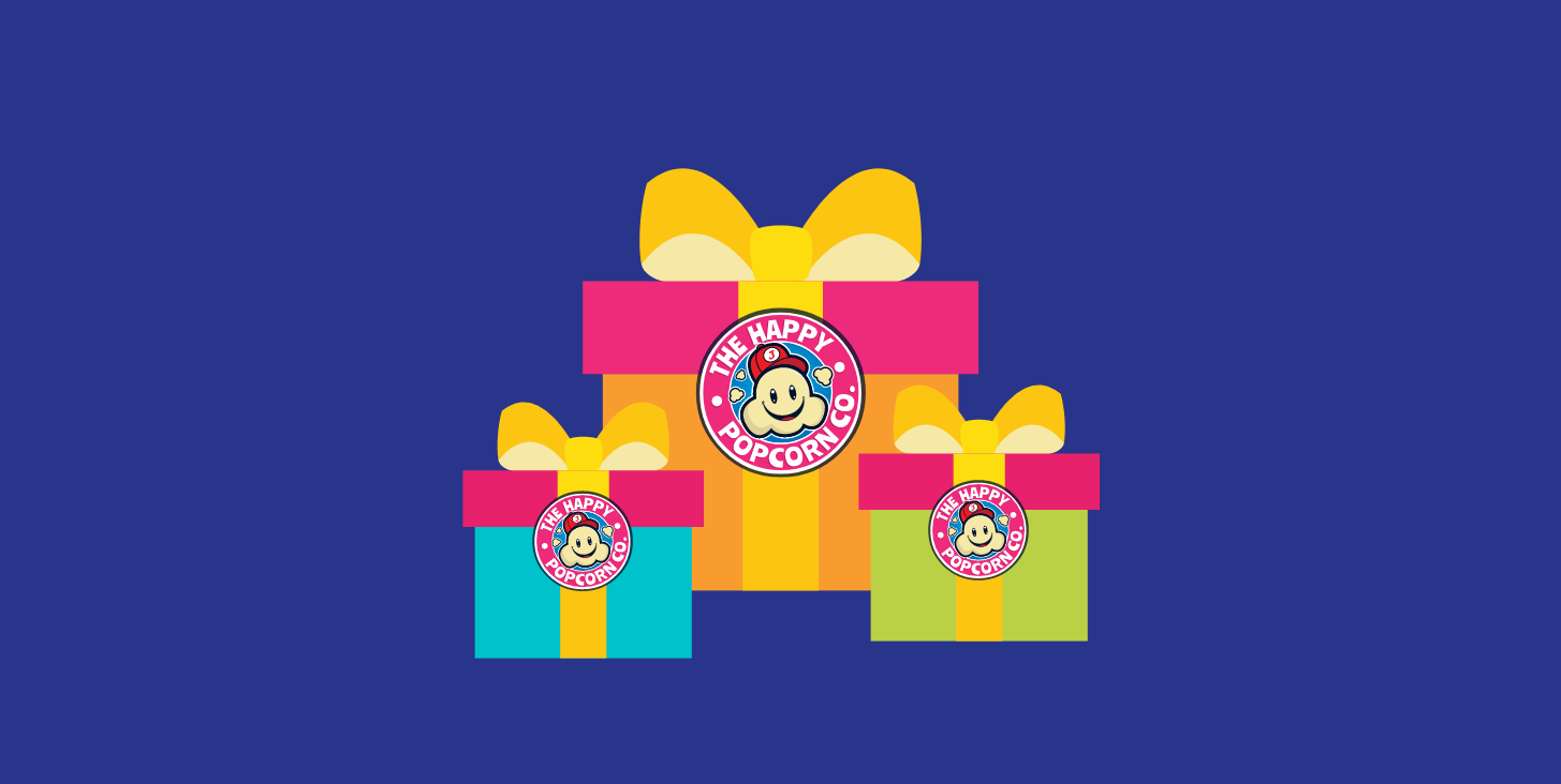 Gift boxes with the Happy Popcorn logo.