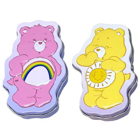 Two colourful care bear-shaped candy tins on a white background.