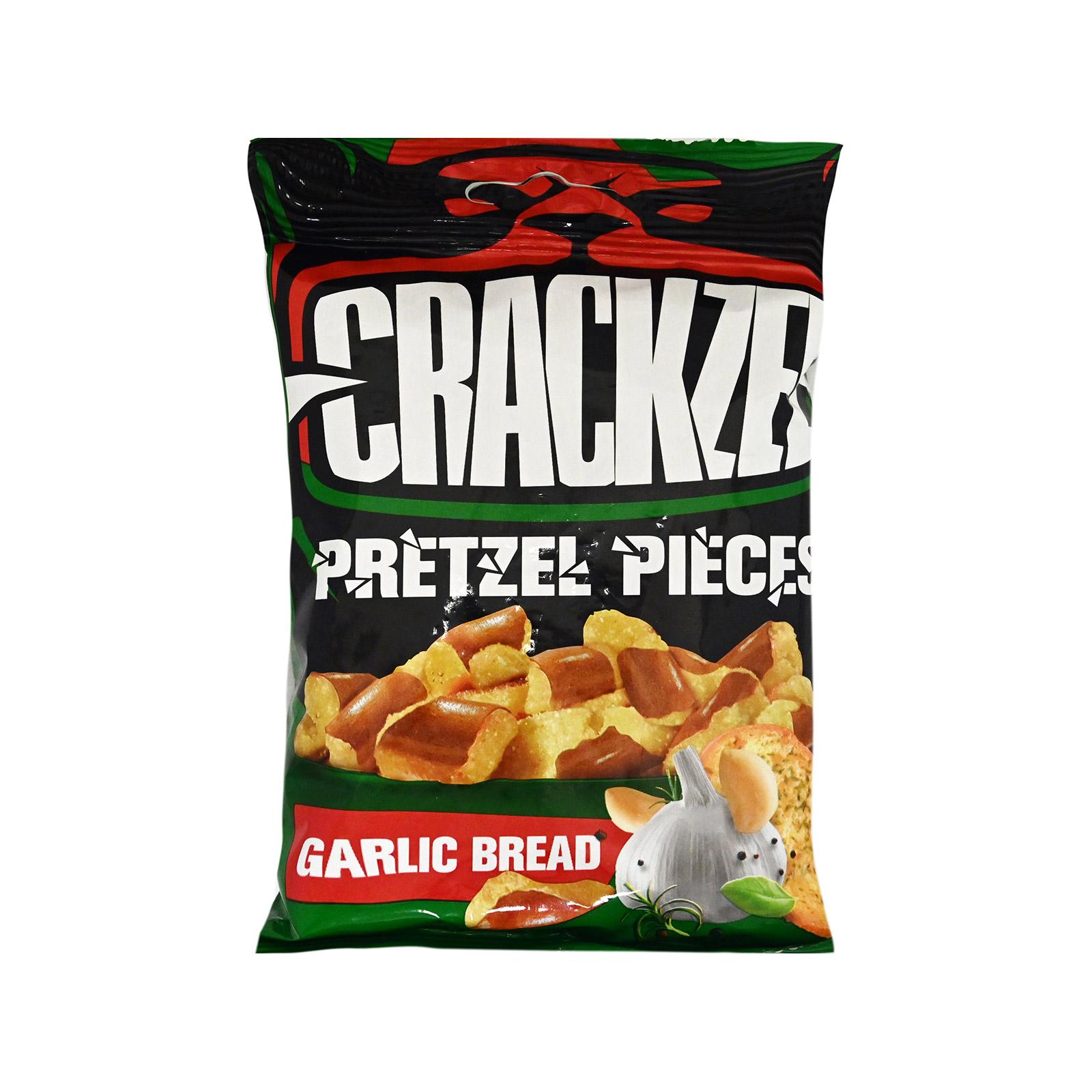 A bag of Crackers Pretzel Pieces Garlic Bread snack chips on a plain white background. The packaging is primarily black with green and red accents, featuring the brand name 'CRACKZELS' in large white letters and an illustration of pretzel pieces and garlic.